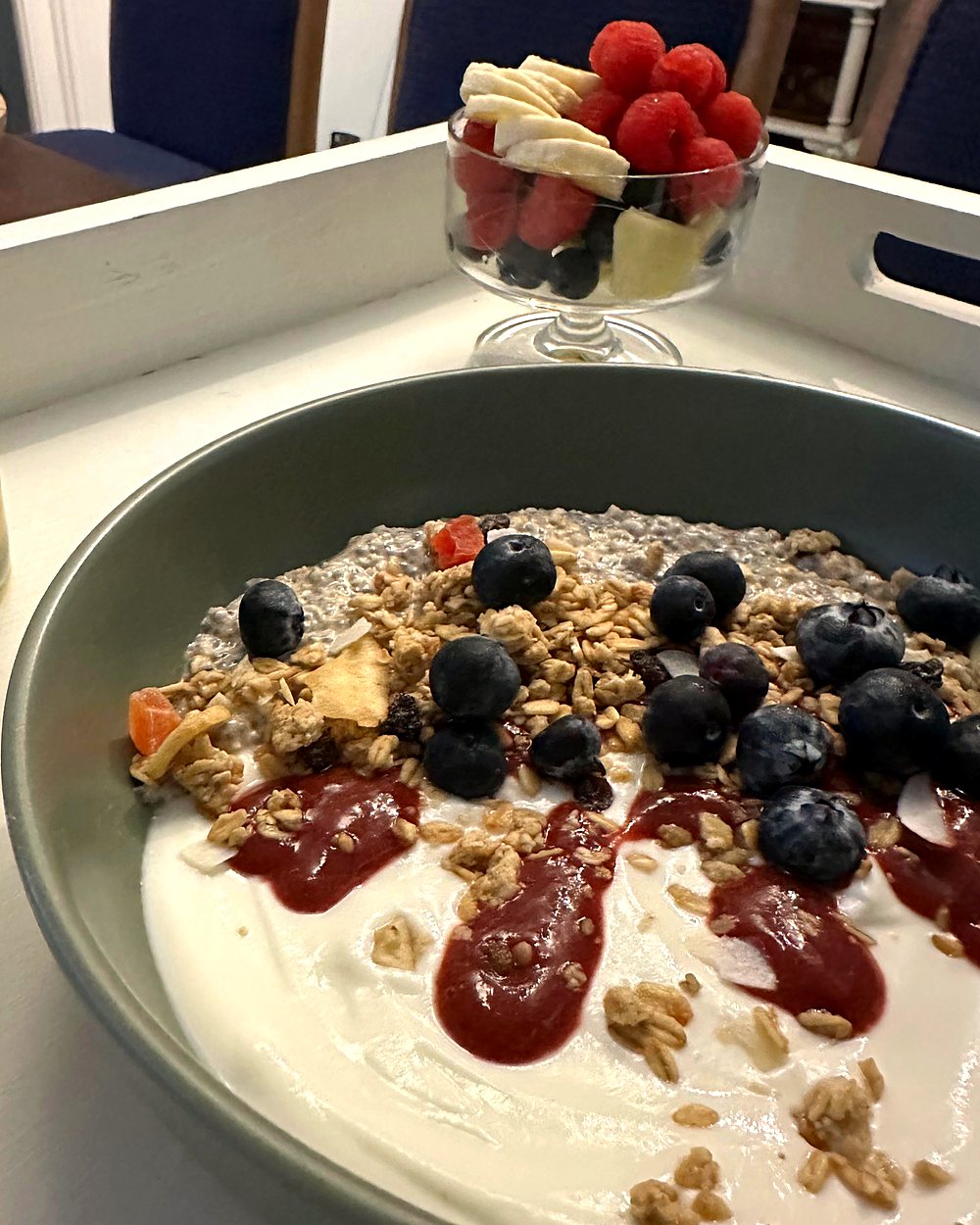 Yoghurt, chia pudding, berries and granola bowl with fresh juice at Oak Manor guest house
